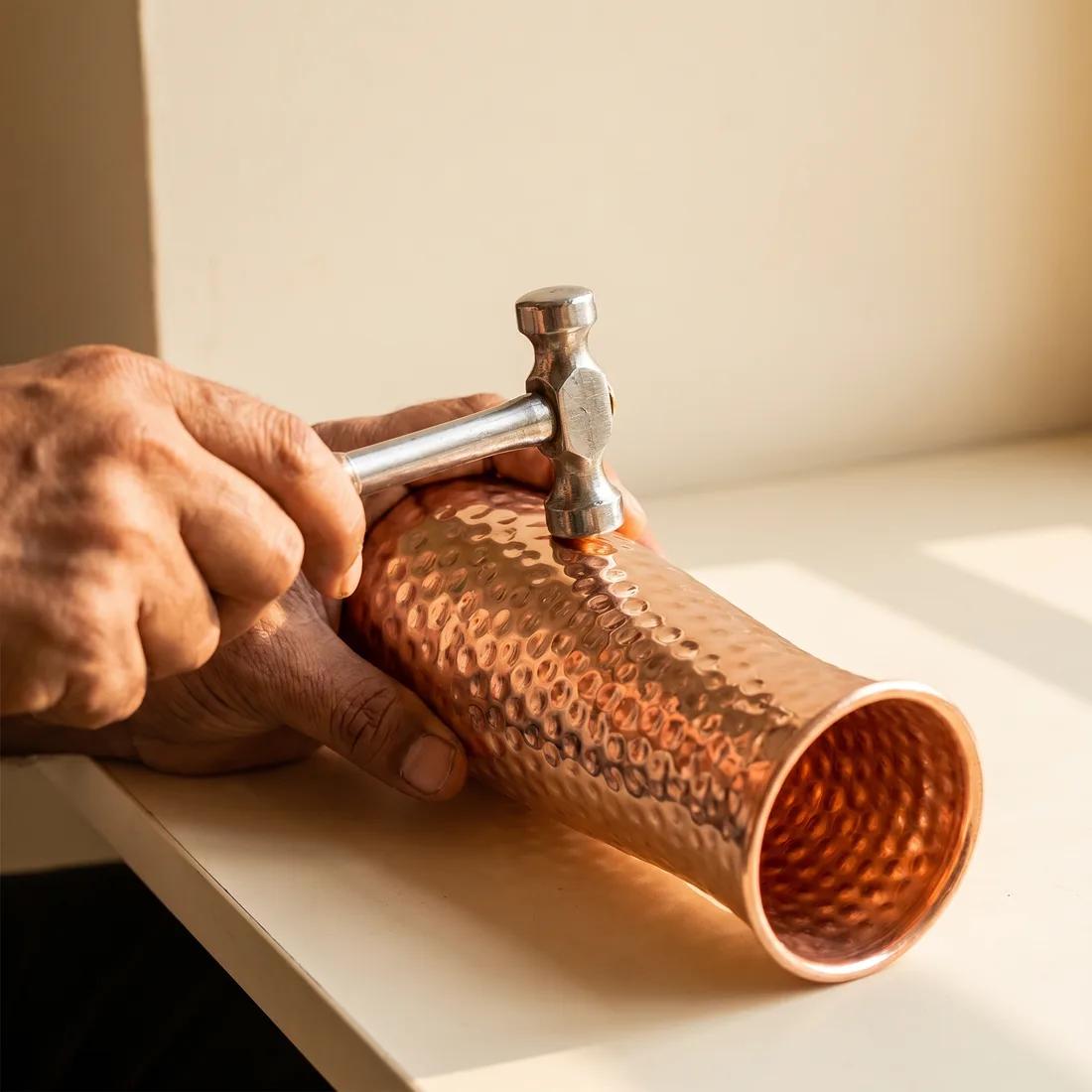 Close-up of the hand-hammered surface of a Coppora copper carafe.