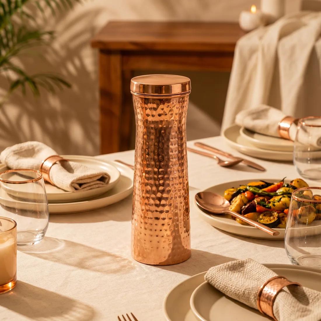 A copper carafe catching the morning light on a kitchen counter.